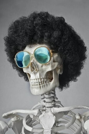 a skeleton wearing glasses